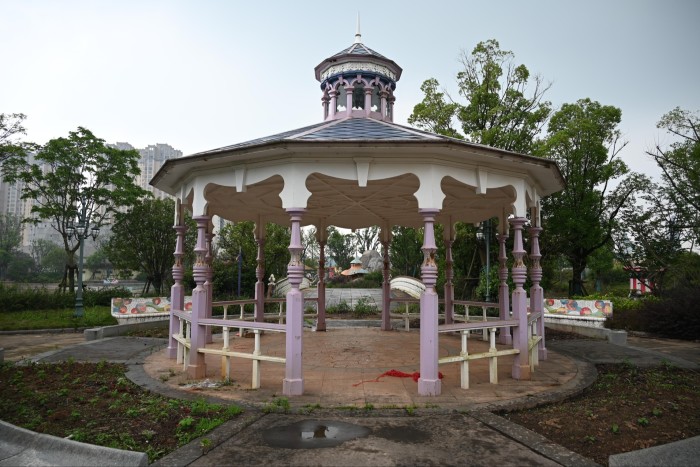 A dilapidated covered band stand