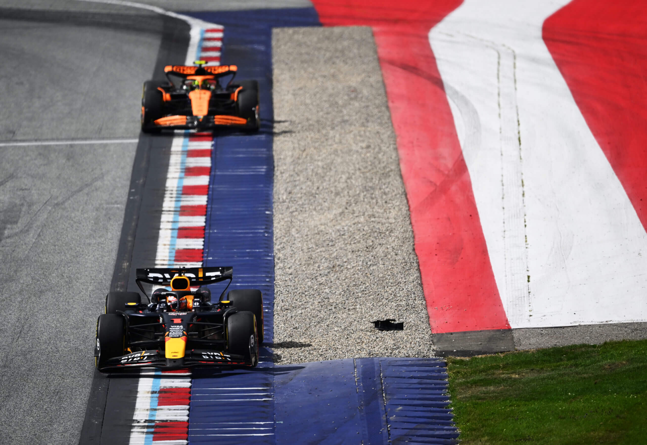 SPIELBERG, AUSTRIA - JUNE 30: Max Verstappen of the Netherlands driving the (1) Oracle Red Bull Racing RB20 leads Lando Norris of Great Britain driving the (4) McLaren MCL38 Mercedes on track during the F1 Grand Prix of Austria at Red Bull Ring on June 30, 2024 in Spielberg, Austria. (Photo by James Sutton - Formula 1/Formula 1 via Getty Images)