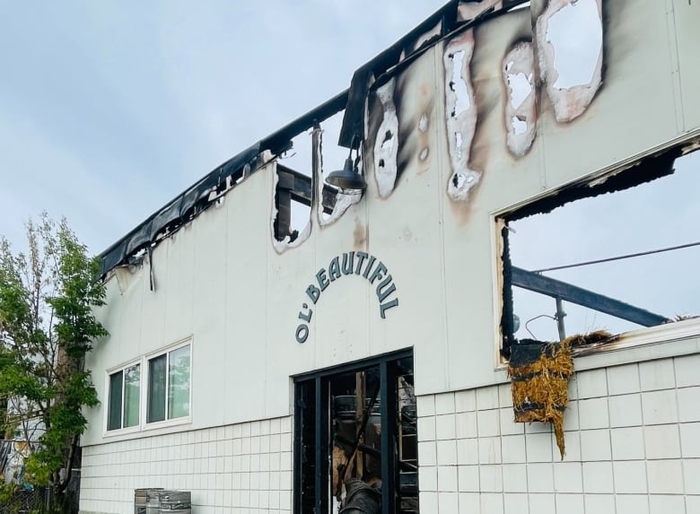 A photo of the burnt facade of a building.