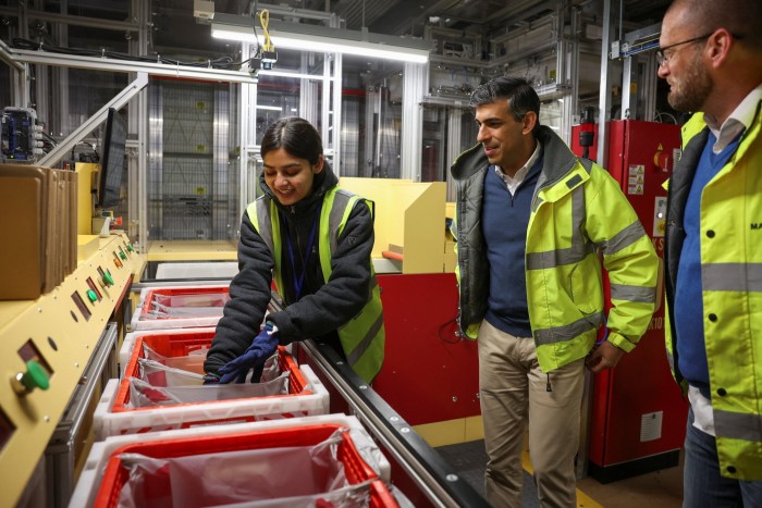 The PM picks up groceries at the Ocado distribution centre 