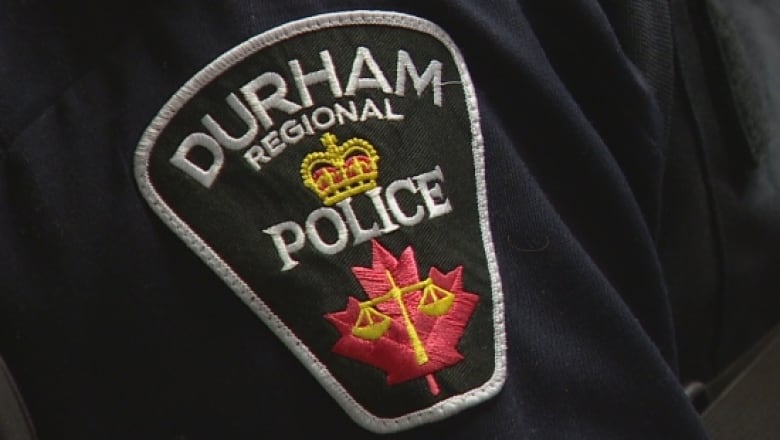 A Durham regional Police uniform badge.