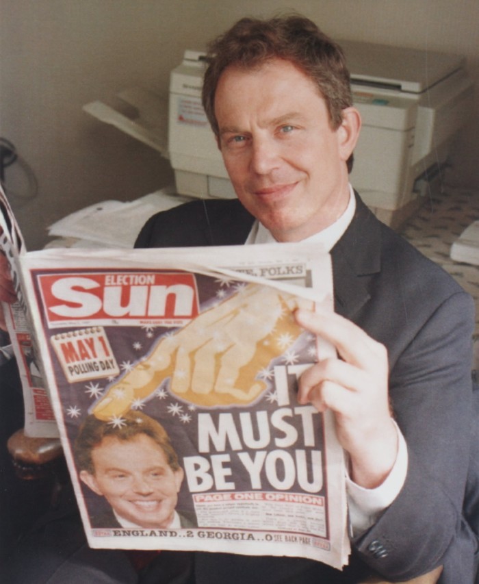 Former prime minister Tony Blair holding a copy of the Sun’s election day special in 199