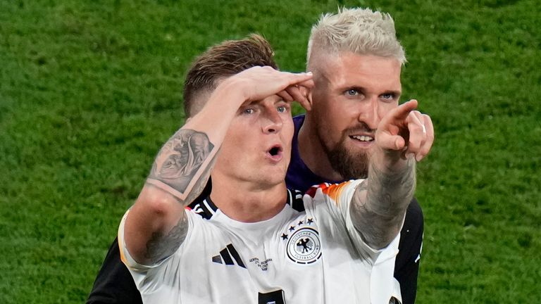 Germany's Toni Kroos, left, and Germany's Robert Andrich gesture at the end of the round of sixteen match between Germany and Denmark at the Euro 2024 soccer tournament in Dortmund, Germany, Saturday, June 29, 2024. (AP Photo/Hassan Ammar)