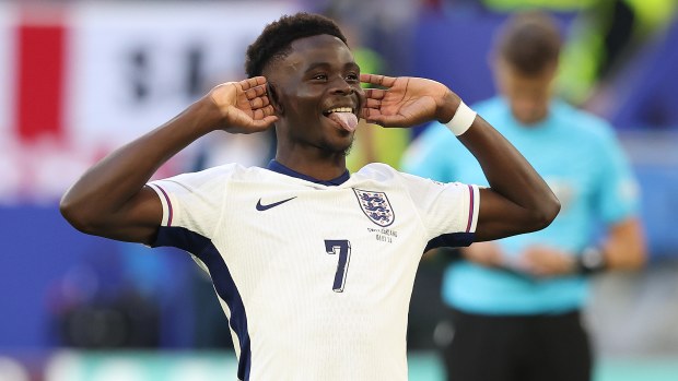 Bukayo Saka of England celebrates after scoring his penalty kick during the penalty shoot out during the UEFA EURO 2024 quarter-final match between England and Switzerland at Dusseldorf Arena on July 6, 2024 in Dusseldorf, Germany. (Photo by Crystal Pix/MB Media/Getty Images)