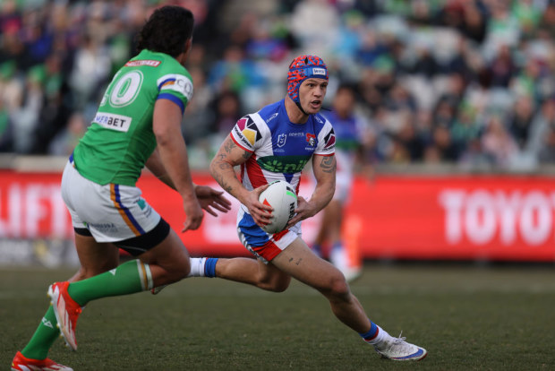 Kalyn Ponga runs the ball.