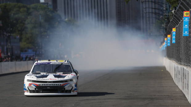 Shane Van Gisbergen, driver of the #97 WeatherTech Chevrolet, celebrates with a burnout after winning the NASCAR Xfinity Series The Loop 110 at Chicago Street Course on July 06, 2024 in Chicago, Illinois. (Photo by Meg Oliphant/Getty Images)