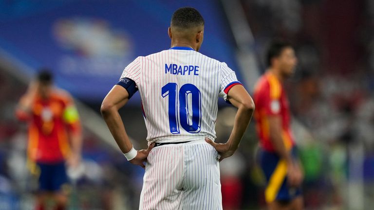 Kylian Mbappe of France stands on the pitch during a semifinal match between Spain and France at the Euro 2024 soccer tournament in Munich, Germany, Tuesday, July 9, 2024. (AP Photo/Antonio Calanni)