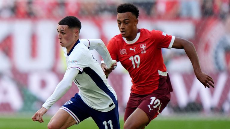 Phil Foden and Dan Ndoye battle for the ball