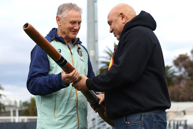 Wallabies coach Joe Schmidt is presented with a didgeridoo by First Nations advisor Dean Duncan.