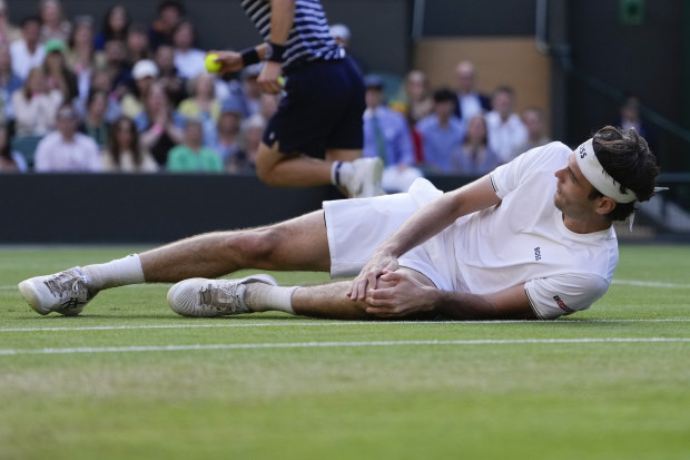 Taylor Fritz of the United States reacts after falling.