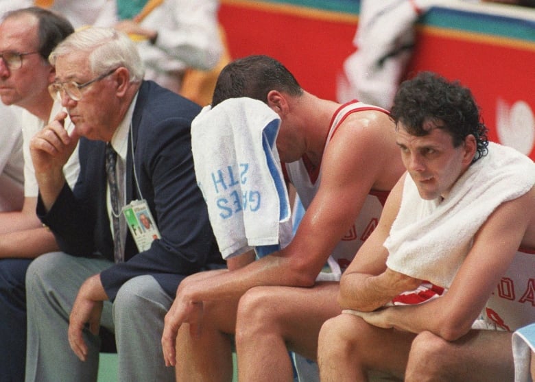 A basketball team on the bench.