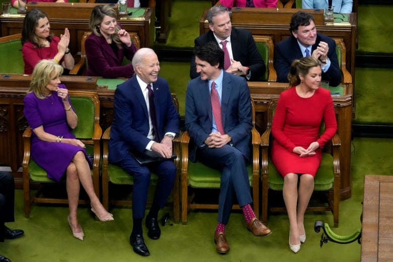 U.S. President Joe Biden and Prime Minister Justin Trudeau and their wives are pictured on the floor of the House of Commons.