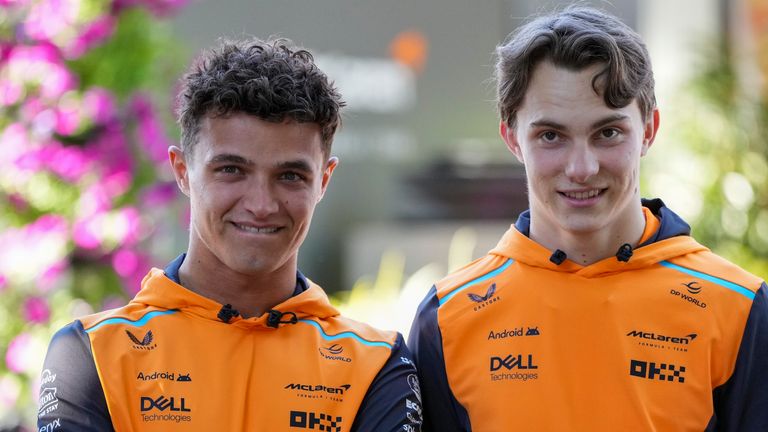 McLaren driver's Lando Norris, left, of Britain and Oscar Piastri of Australia react ahead of the Australian Formula One Grand Prix at Albert Park, Melbourne, Australia, Thursday, March 21, 2024. (AP Photo/Asanka Brendon Ratnayake)