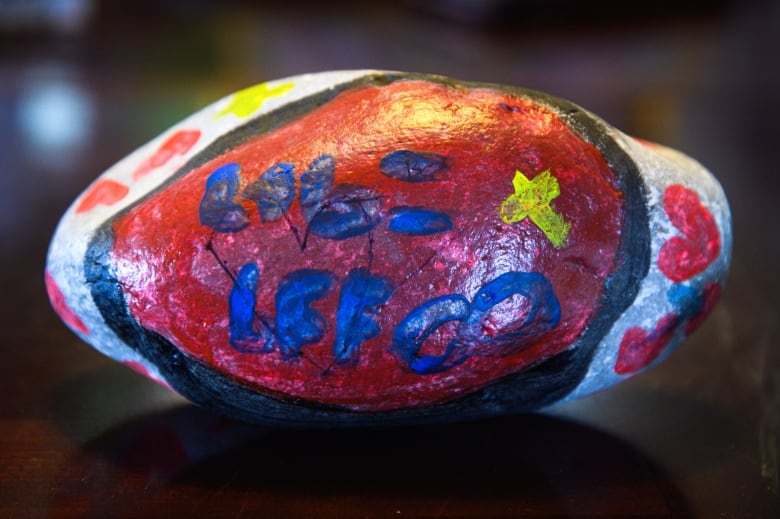 The family says the hospital provided three rocks for them to paint to add to a garden outside the critical care unit. Lucas' rock reads "L+B = BFF ∞"