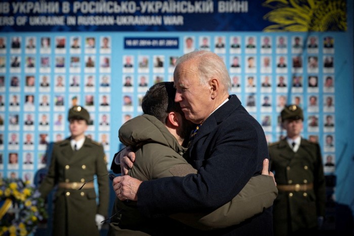 President Joe Biden embraces Ukraine’s President Volodymyr Zelenskyy as they visit the Wall of Remembrance to pay tribute to killed Ukrainian soldiers, amid Russia’s war in Ukraine, in Kyiv, Ukraine February 20 2023