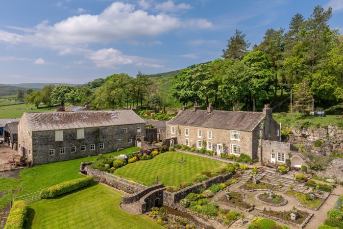 an old stone farmhouse set around a walled garden