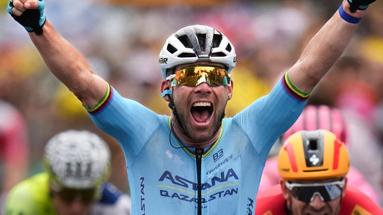 Britain's sprinter Mark Cavendish celebrates as he crosses the finish line to win a record 35th Tour de France stage win to break the record of Belgian legend Eddy Merckx in the fifth stage of the Tour de France cycling race over 177.4 kilometers (110.2 miles) with start in Saint-Jean-de-Maurienne and finish in Saint-Vulbas, France, Wednesday, July 3, 2024. (AP Photo/Daniel Cole)