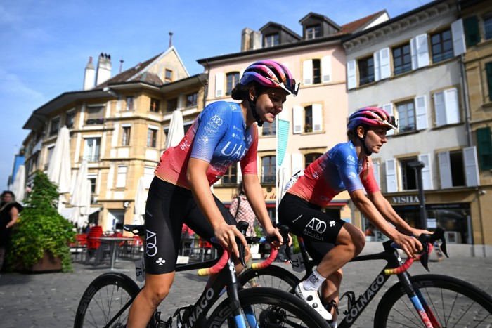 Alena Ivanchenko cycling with a colleague in Switzerland 