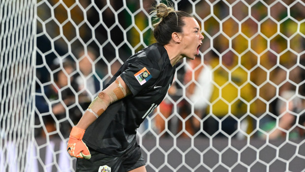 Mackenzie Arnold celebrates after saving the first penalty of France from Selma Bacha.