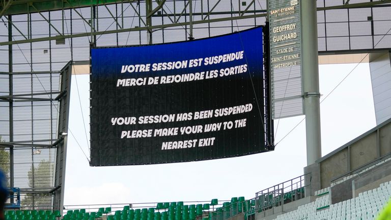 The video screen announces that the match has been suspended during the men's Group B soccer match between Argentina and Morocco at Geoffroy-Guichard Stadium at the 2024 Summer Olympics, Wednesday, July 24, 2024, in Saint-Etienne, France. (AP Photo/Silvia Izquierdo)