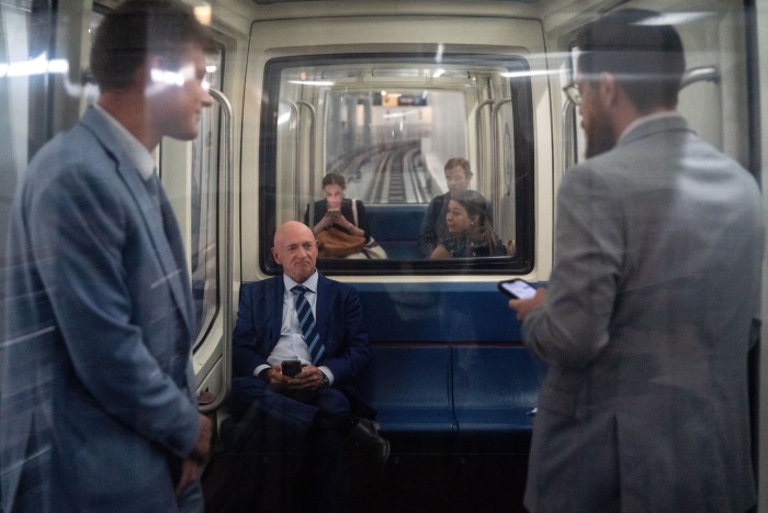 Senator Mark Kelly rides the subway in Washington