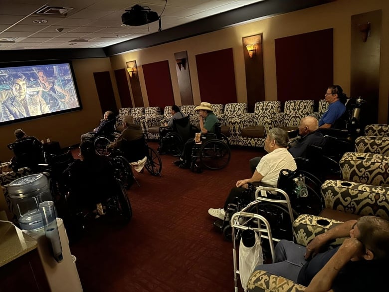 Residents of a care home watch a movie dubbed in the Lakota language