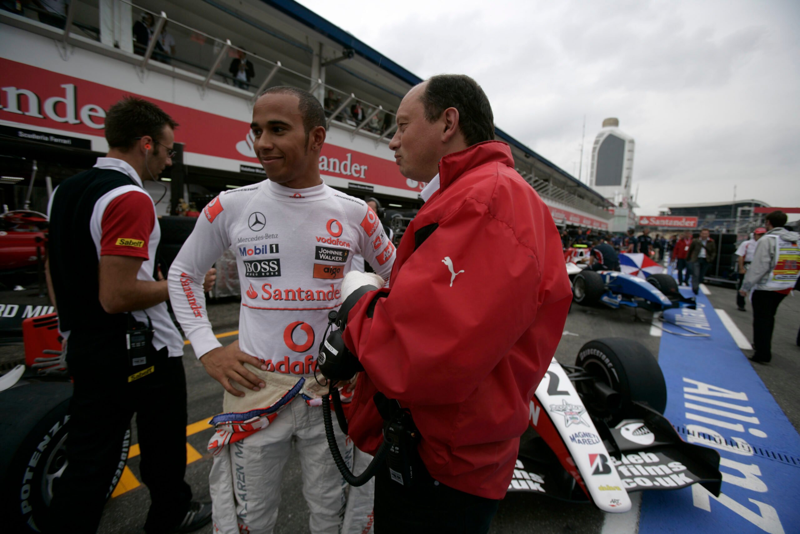 2010 GP2 Series. Round 6. Hockenheim, Germany. 23rd July. Friday Qualifying. Lewis Hamilton talks with Frederic Vasseur, ART Grand Prix team principal. Portrait.