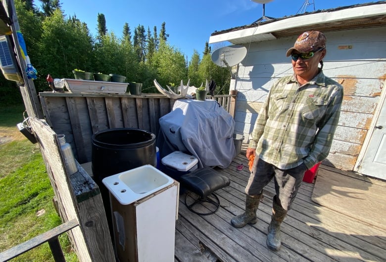 A disconnected sink sits outside the house which acts as a wash basin. 