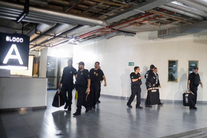 Federal police officers leave the headquarters of the Liberal Party during an operation targeting some of former president Jair Bolsonaro’s top aides in Brasilia, Brazil February 8, 2024