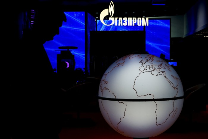 Montage of Gazprom logo and a globe