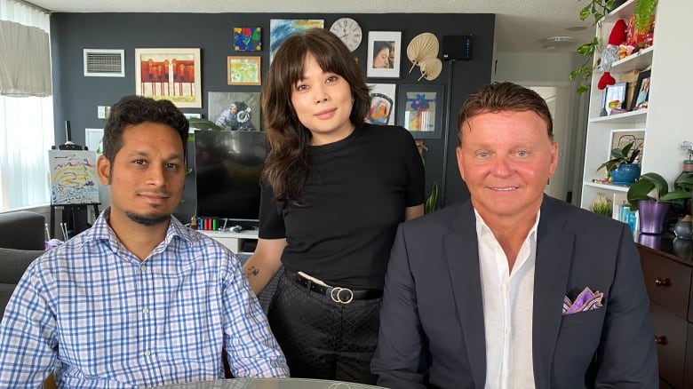 Raulson Sequeira, Richelle Komes and Steve Moran side by side in a colourful living room. 