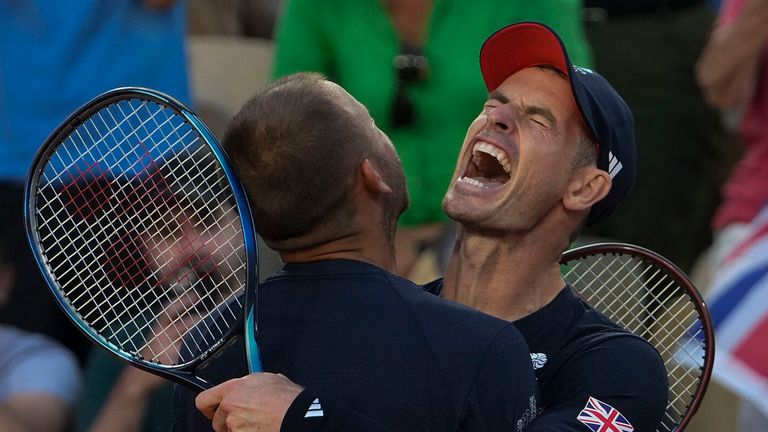 Andy Murray and Daniel Evans of Britain celebrate after defeating Kei Nishikori and Toro Daniel of Japan in the men's doubles tennis competition, at the 2024 Summer Olympics, Sunday, July 28, 2024, in Paris, France. (AP Photo/Andy Wong)