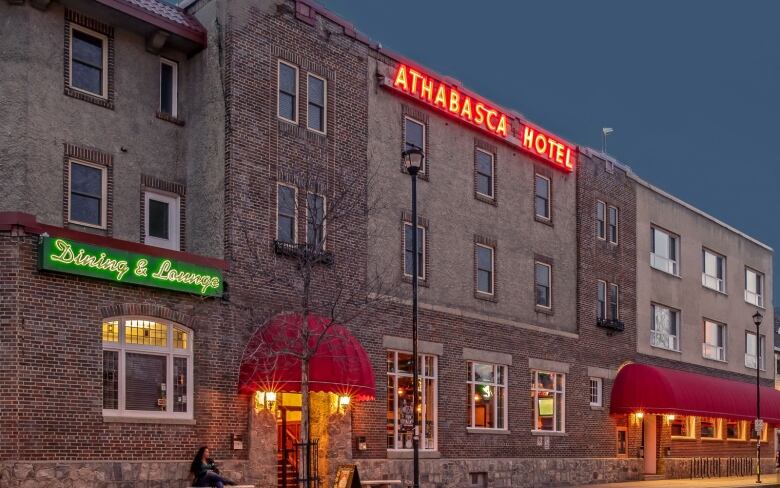 brick building with light-up sign