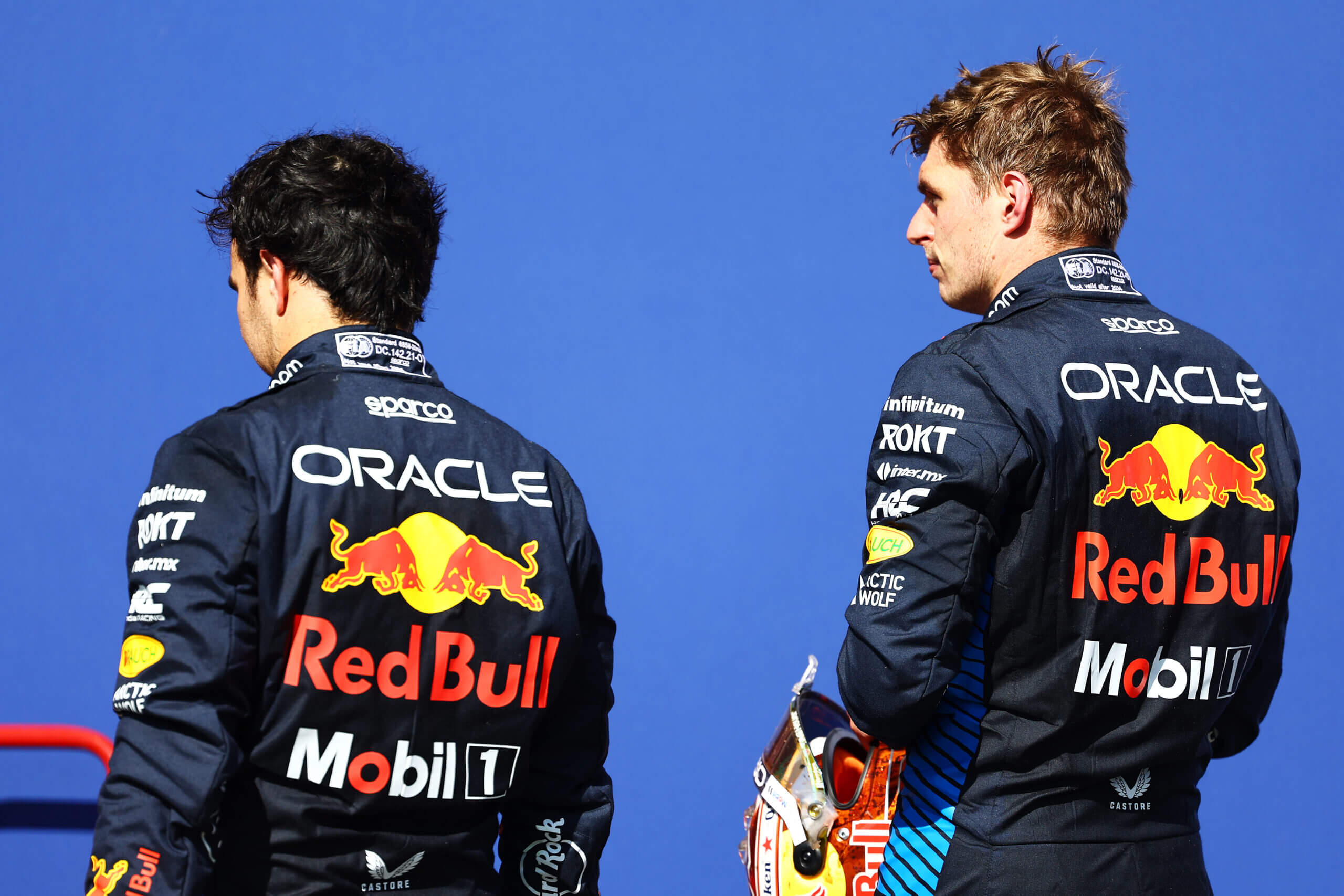 SPA, BELGIUM - JULY 28: 5th placed Max Verstappen of the Netherlands and Oracle Red Bull Racing and 8th placed Sergio Perez of Mexico and Oracle Red Bull Racing talk in parc ferme during the F1 Grand Prix of Belgium at Circuit de Spa-Francorchamps on July 28, 2024 in Spa, Belgium. (Photo by Mark Thompson/Getty Images)