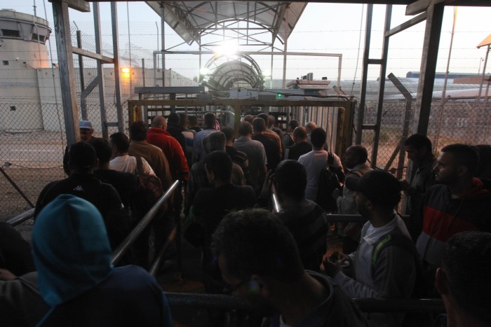 West Bank residents line up to enter Israel for work before the Gaza war prompted a ban