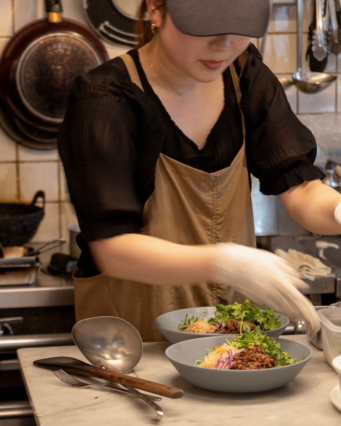 A woman at work preparing Alaska Zwei’s lunch options