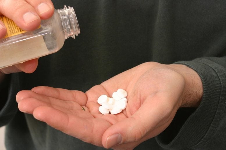 Pouring Aspirin Tablets