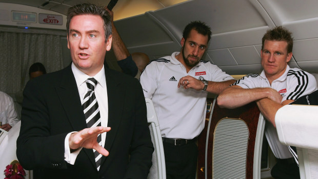 Eddie McGuire speaks with Collingwood players Anthony Rocca and Nathan Buckley in 2005.