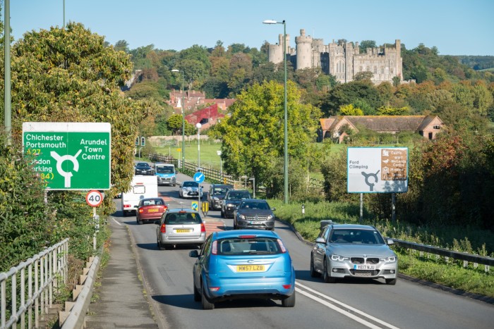 Vehicles travelling along the Arundel bypass, the A27 road, near to Arundel Castle in Arundel, West Sussex, UK