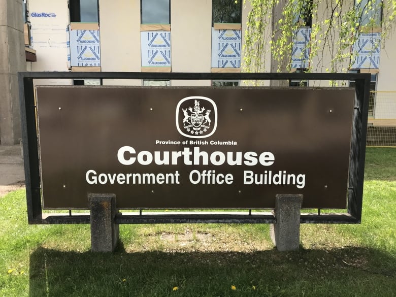 A brown sign outside a provincial courthouse in Smithers B.C.