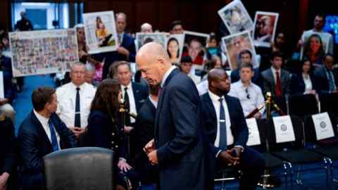 Dave Calhoun returns to his seat at a Senate hearing related to Boeing in Washington, DC.