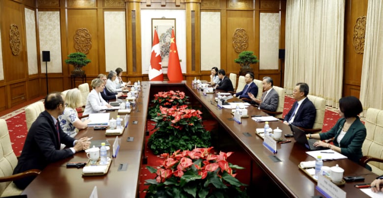 Foreign Affairs Minster Mélanie Joly and Chinese Foreign Minister Wang Yi sit down for diplomatic discussions with their teams Friday in Beijing