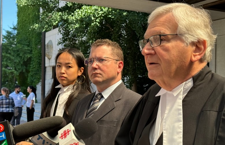 Brian Nadler, center, standing with his defense team outside the Ottawa courthouse Tuesday following his acquittal of first degree murder and criminal negligence charges. 