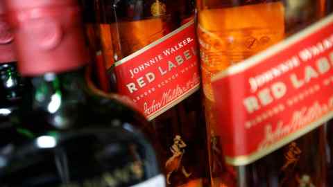 Bottles of Johnnie Walker and Buchanan’s whiskies on display at a liquor store in Mexico City that sells spirits distributed by Diageo