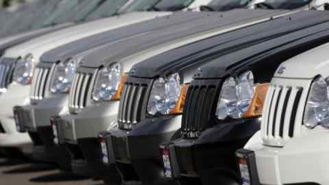 Jeep Cherokee SUVs at a car dealership in Denver, US