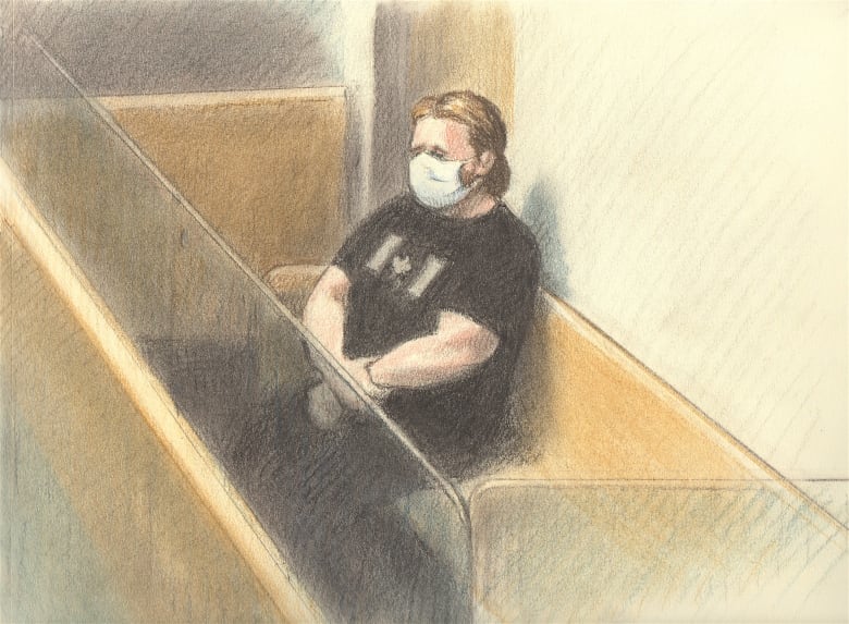 A court sketch of a man sitting arms crossed while wearing a black Canadian flag t-shirt.