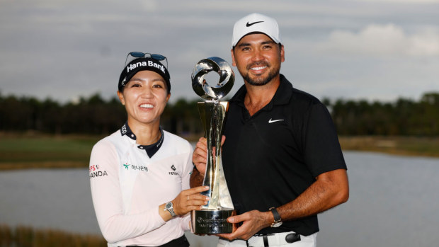 Lydia Ko (L) and Jason Day (R) with the Grant Thornton Invitational trophy.