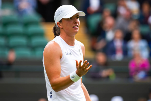 Iga Swiatek in action against Yulia Putintseva of Kazakhstan in the third round on Day Six of The Championships Wimbledon 2024 at All England Lawn Tennis and Croquet Club on July 06, 2024 in London, England (Photo by Robert Prange/Getty Images)