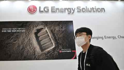 A visitor walks past a booth of LG Energy Solution during an exhibition in Seoul, South Korea