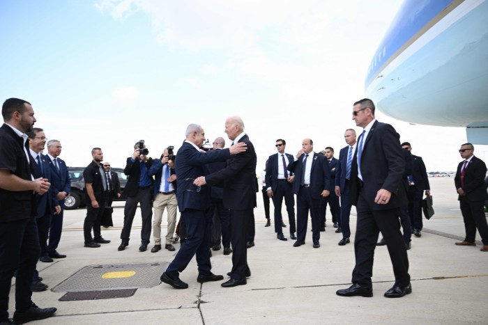 Israeli Prime Minister Benjamin Netanyahu, left, greets President Joe Biden upon his arrival at Tel Aviv’s Ben Gurion airport on October 18, 2023